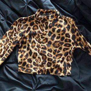 This is a leopard print crop top that’s right above the belly button.